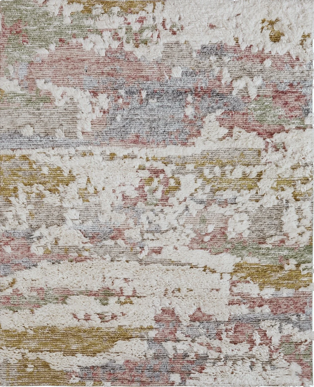 Close-up of a textured, abstract-patterned rug with cream, pink, green, gray, and gold colors.