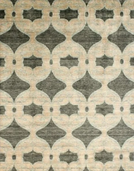 Patterned rug with geometric shapes in beige, gray, and black tones.