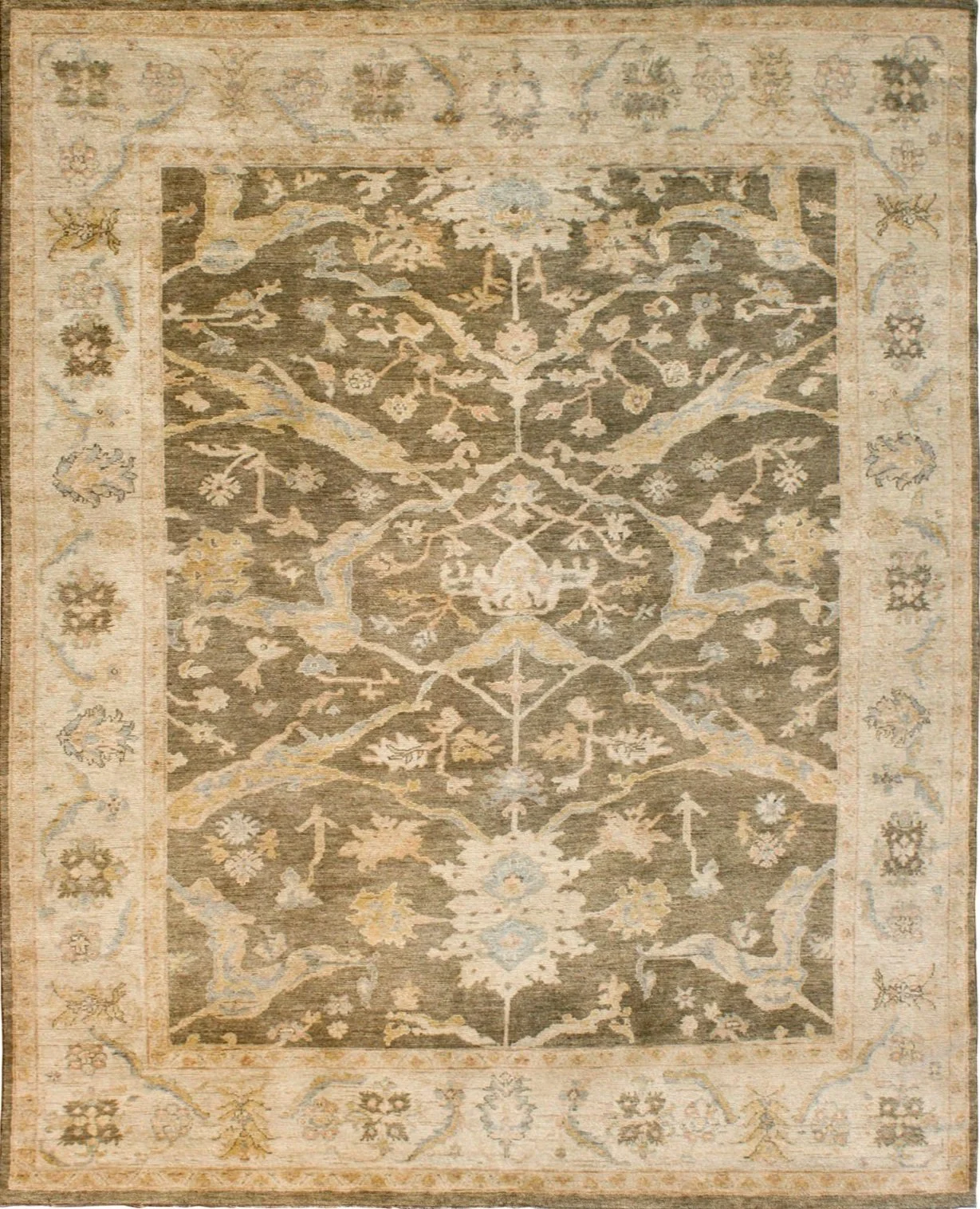 A vintage, patterned area rug with a beige border featuring floral and geometric motifs, and a central design with an intricate tree of life pattern in shades of brown, blue, and cream.