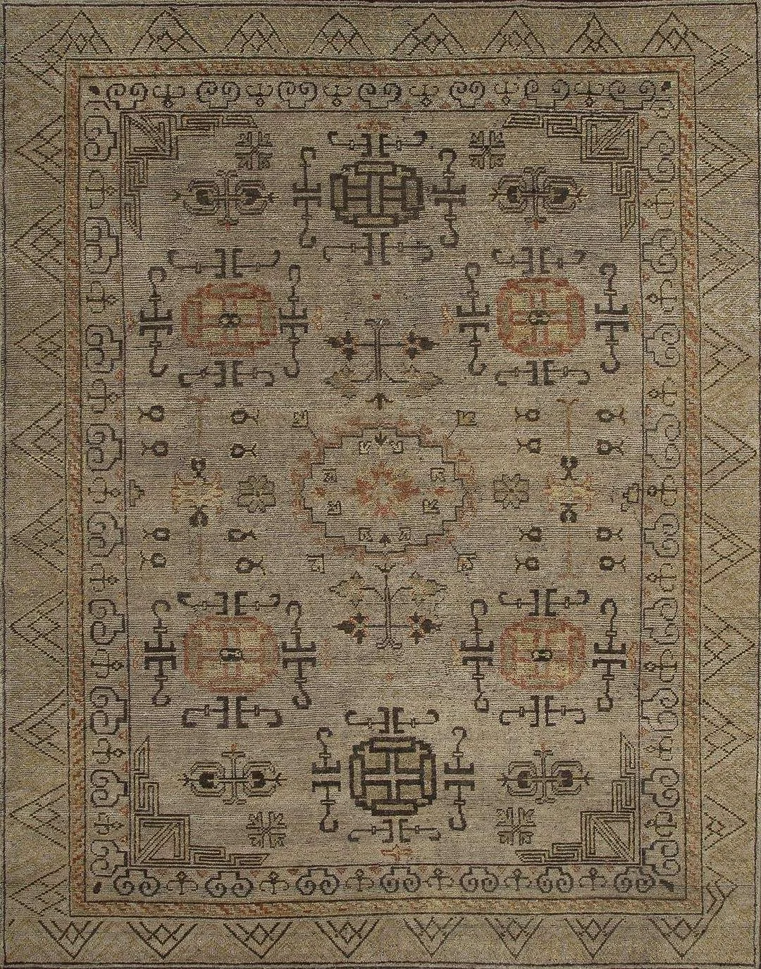 A traditional Persian-style area rug with intricate geometric and floral patterns in shades of beige, brown, black, and red.