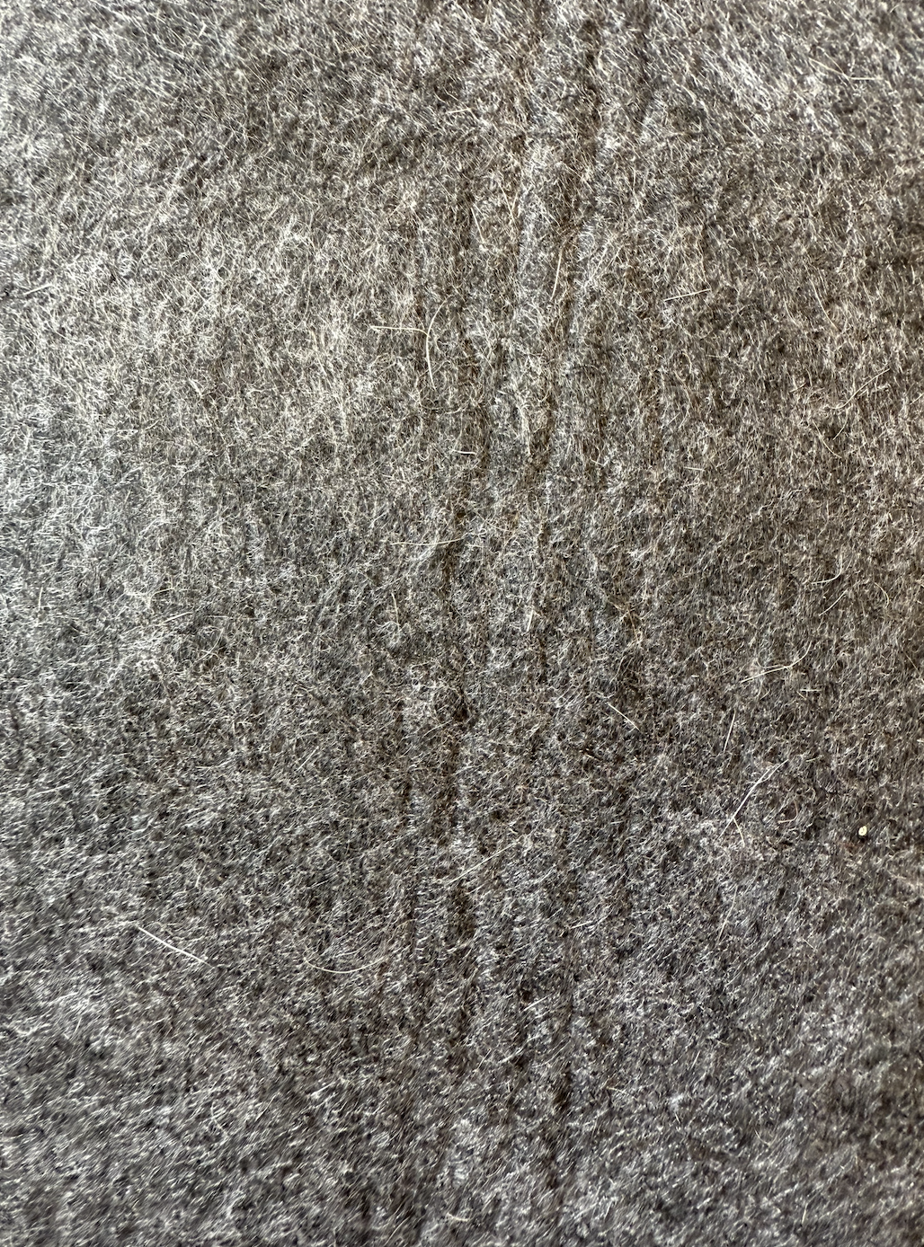 Close-up of brown fur with gray and white fibers.
