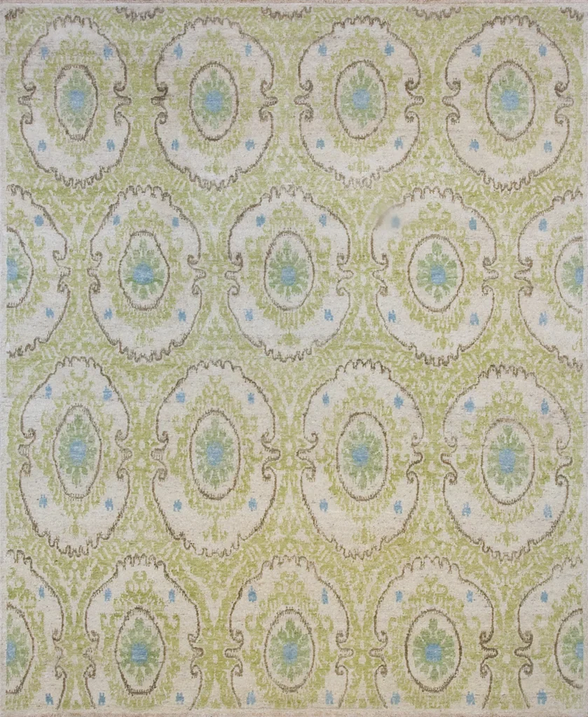 Patterned fabric with a repeating design of oval shapes in green, blue, and beige.