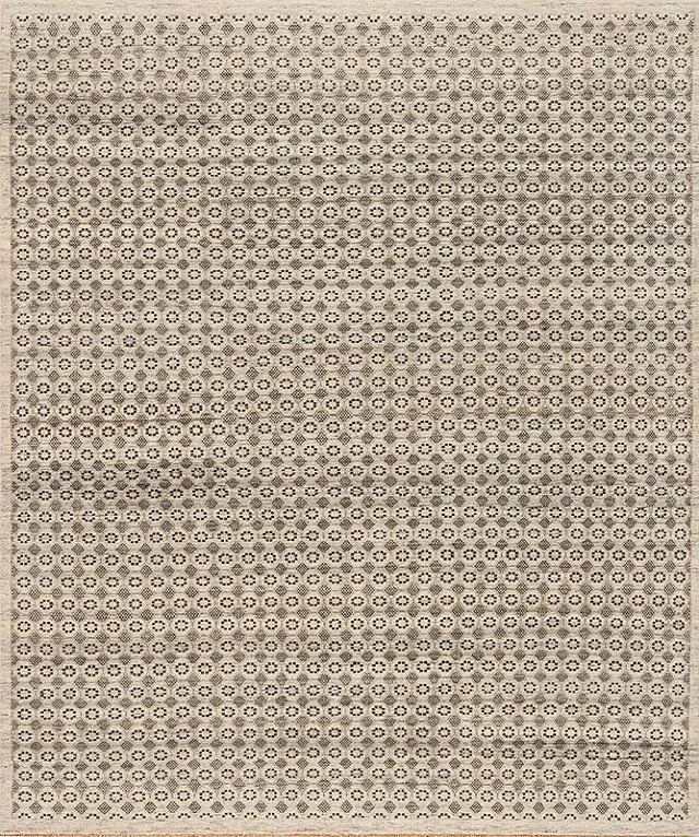 Close-up of a perforated surface or fabric with a pattern of small circles and holes creating a textured pattern.