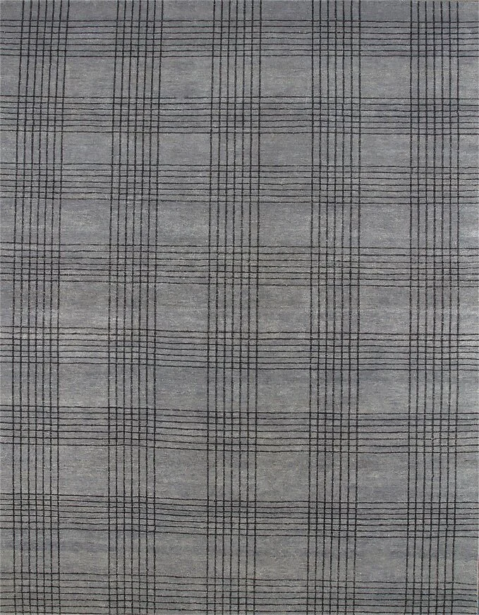 Close-up of a fabric with a gray background and a black plaid pattern.