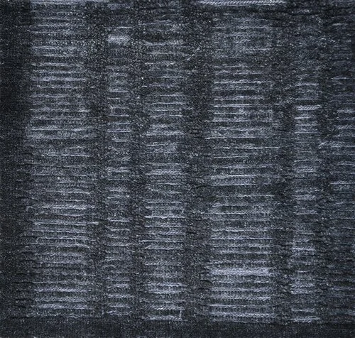 Close-up of a textured dark fabric with a pattern of horizontal and vertical lines.