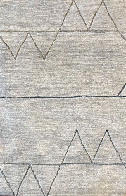 Close-up image of a sage rug with geometric pattern