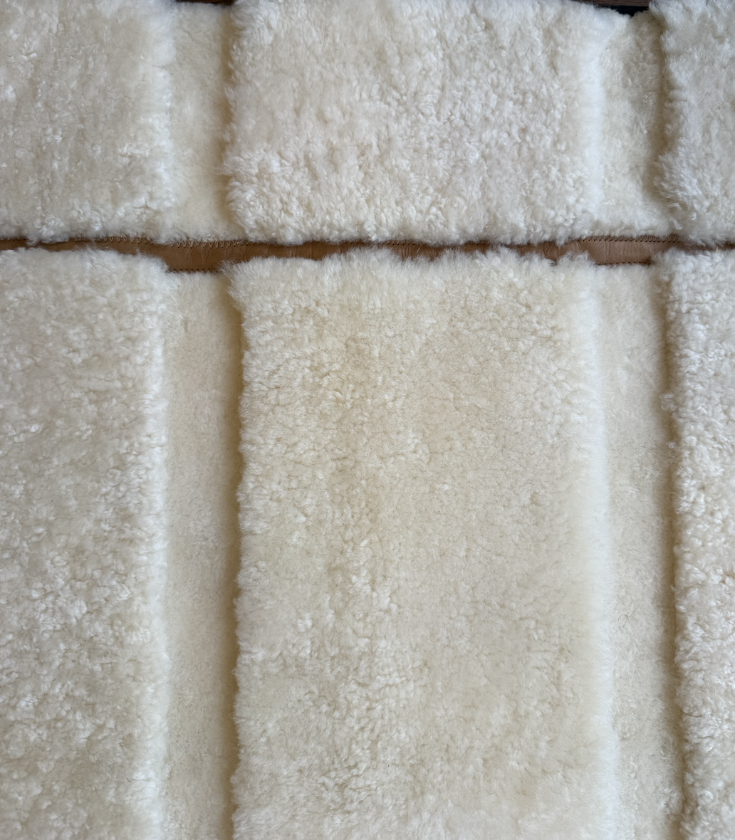 Close-up of cream-colored, fluffy, textured fabric panels.