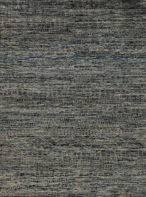 Close-up of a textured fabric with a horizontal striped pattern in shades of black, gray, and beige.
