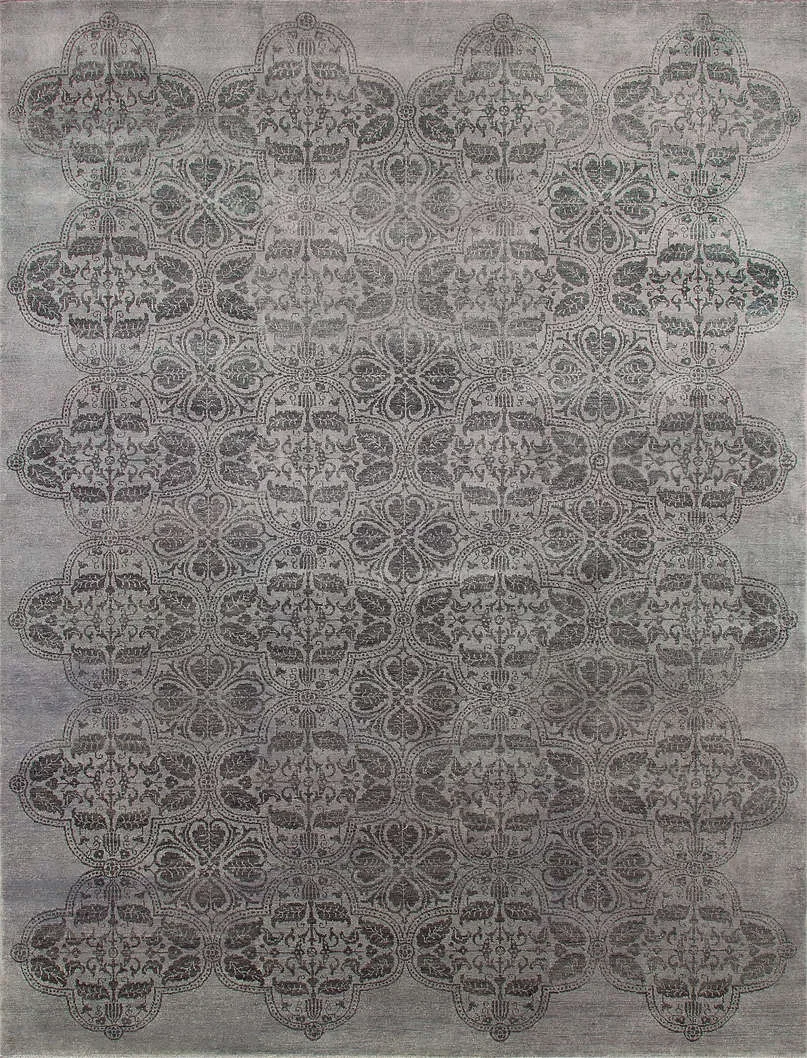 A gray carpet with an intricate black and white floral and geometric pattern.