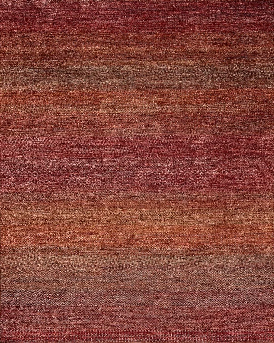 A textured, multicolored red and brown fabric surface.