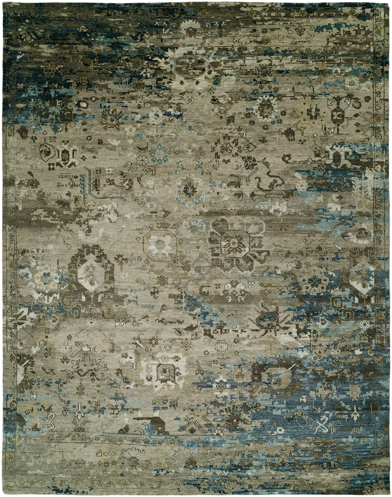 An area rug with distressed, vintage-style floral and geometric patterns in shades of beige, gray, blue, and brown.