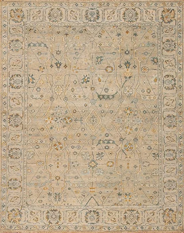 An intricate patterned beige and light blue rug with floral and geometric designs, framed by a border with floral motifs.
