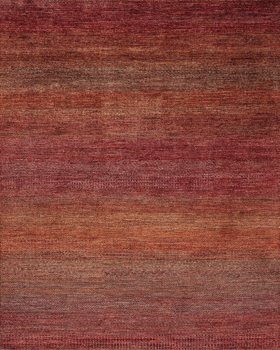 Close-up of a woven textile with various shades of red and brown.
