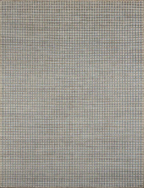 Close-up of a patterned fabric with small blue, beige, and black geometric designs.