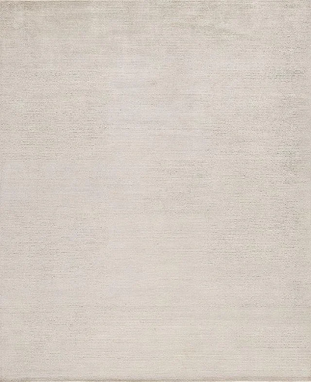 The image shows a blank, textured beige surface with no specific objects or features.