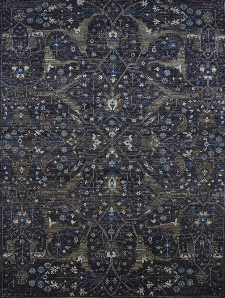 A dark, intricately patterned Oriental rug with floral and geometric designs in shades of blue, white, and beige.