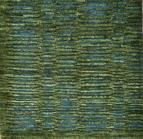 Close-up of a textured surface with blue and green horizontal and vertical lines creating a grid pattern
