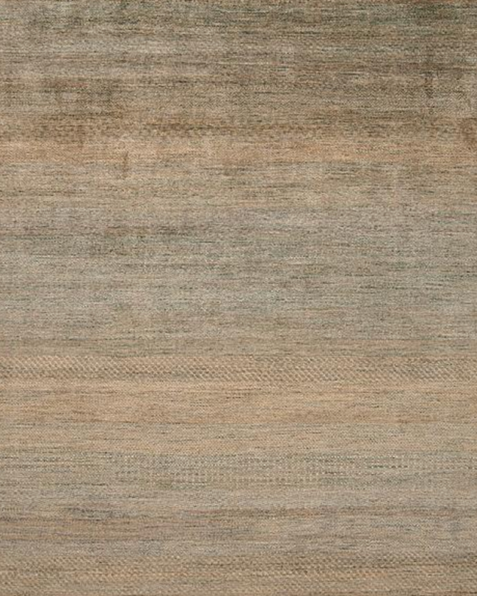 Close-up of a textured beige and brown fabric surface.