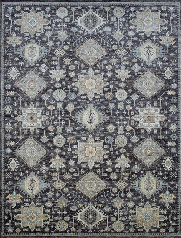 A patterned area rug with intricate geometric and floral motifs in shades of blue, beige, and cream.