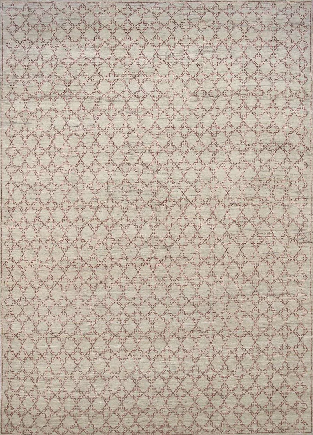 Patterned rug with a delicate, repeating geometric design in red and white.