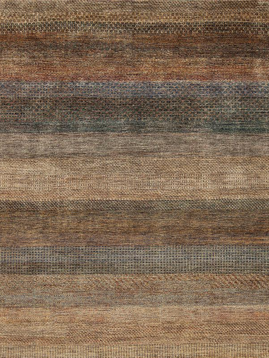 Close-up of a multicolored woven textile or rug with horizontal stripes in shades of brown, beige, gray, and dark blue.