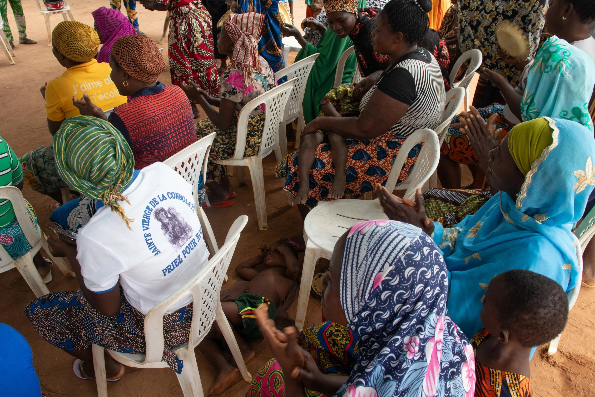Little boy asleep on the floor during the ‘too-long’ meeting. This group specialized in small-scale livestock production, community health, and hygiene education to improve families and communities, August 2024.