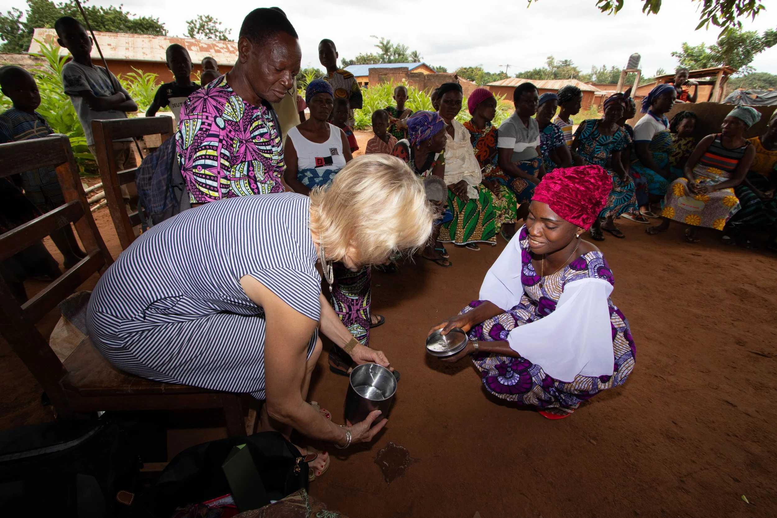 Elizabeth is pouring water for the ancestors as a sign of respect, August 2025. 