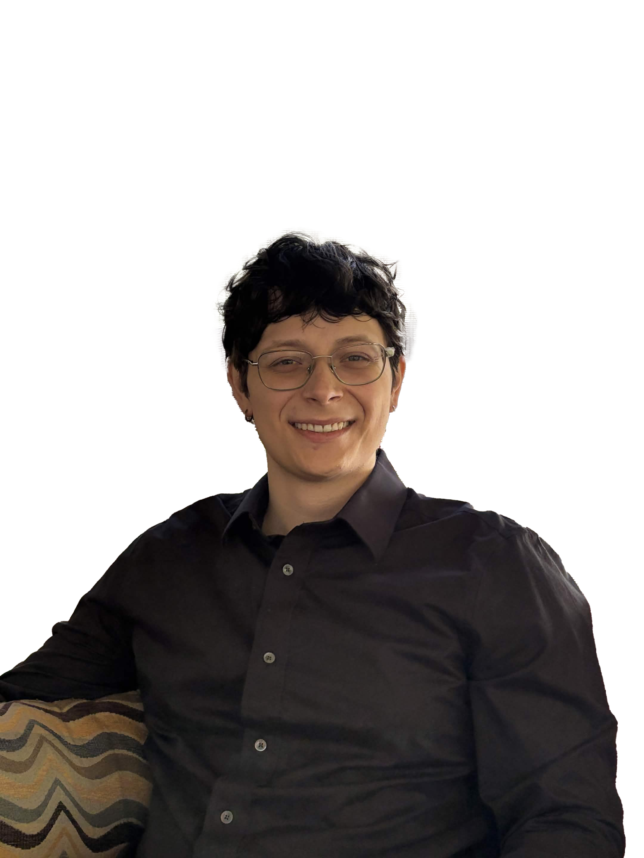 A man with glasses smiling at the camera.