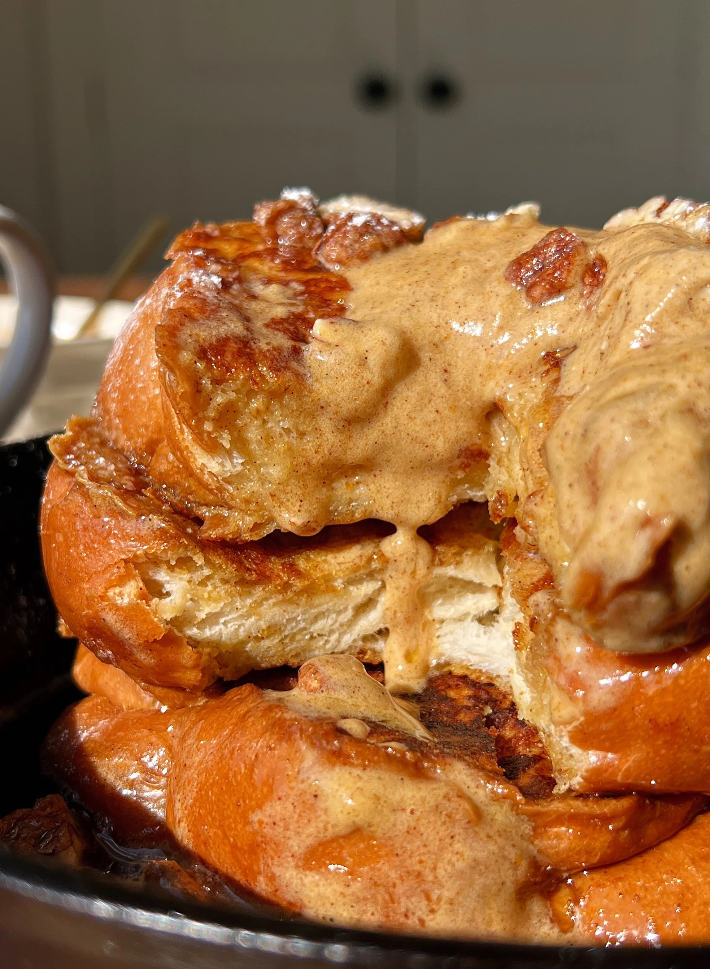 Thick cut pumpkin spice french toast with a perfectly golden exterior and soft custardy center served warm with whipped pumpkin mascarpone, powdered sugar, and maple syrup as the ultimate cozy fall breakfast.