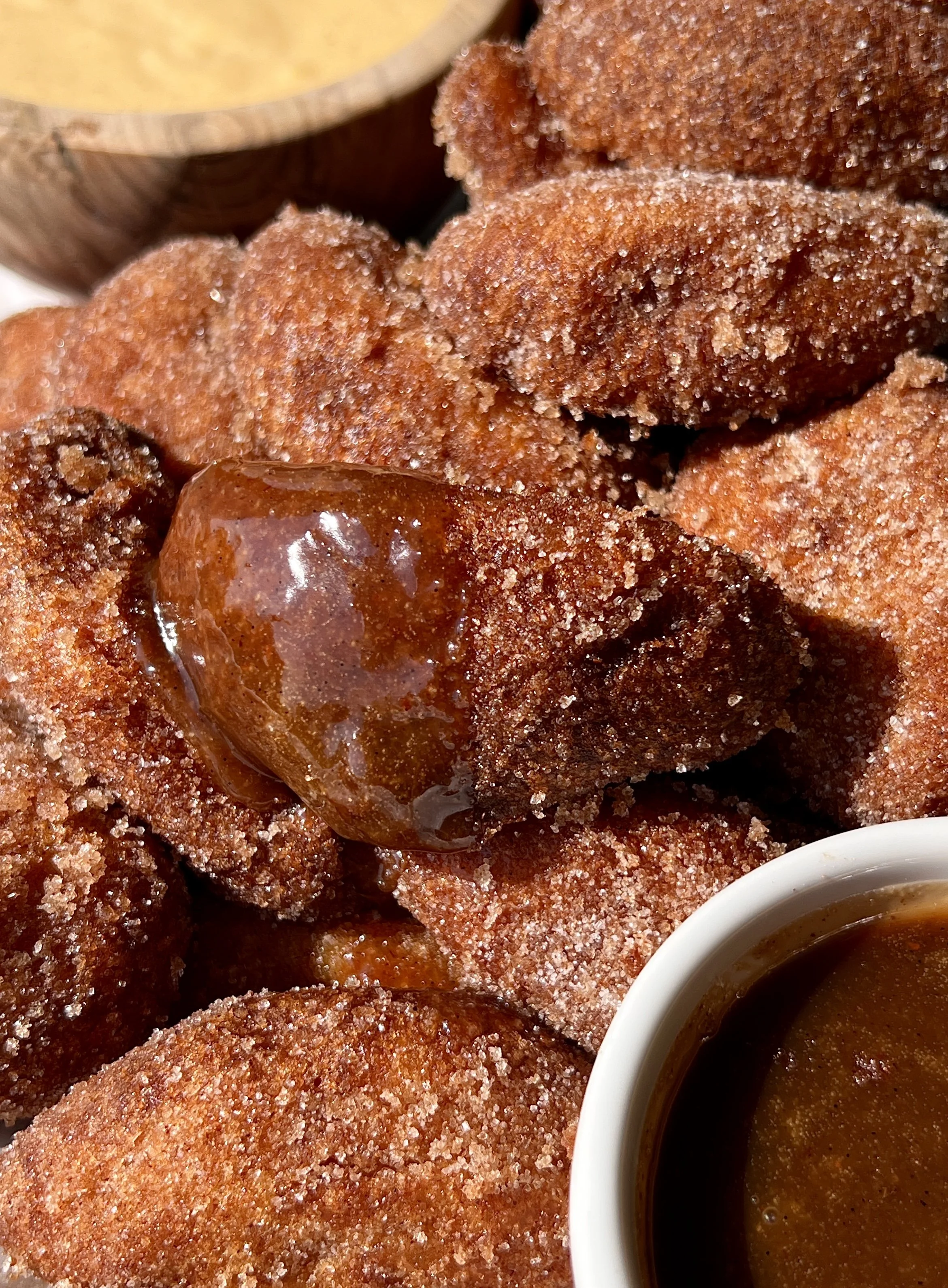 Golden and crisp buttermilk fried peaches rolled in a warm cinnamon sugar coating served with a homemade crème anglaise and an easy salted caramel as the ultimate elegant summer dessert.