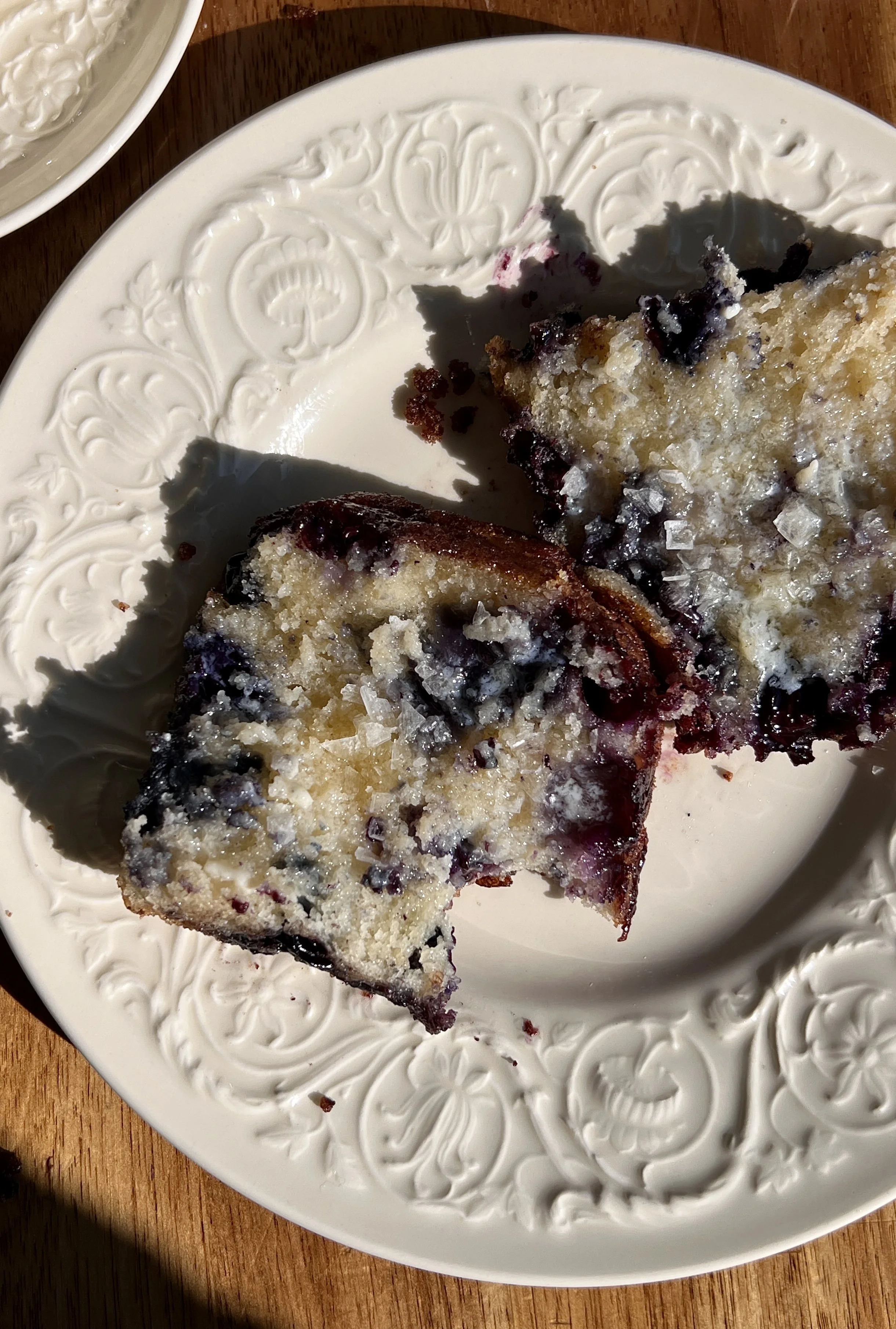 Warm cinnamon crunch blueberry butter swim biscuits served with butter, flaky sea salt, and coffee.