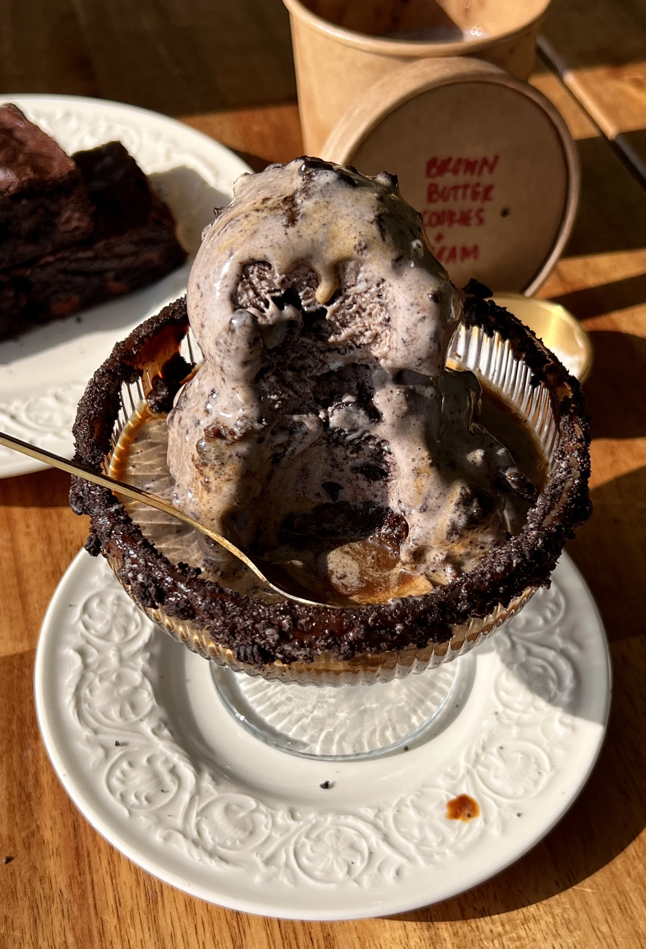 Rich and creamy brown butter cookies and cream ice cream made with an Oreo custard base served affogato-style over a warm brownie with a hot shot of espresso poured right over the top as the ultimate summer dessert.