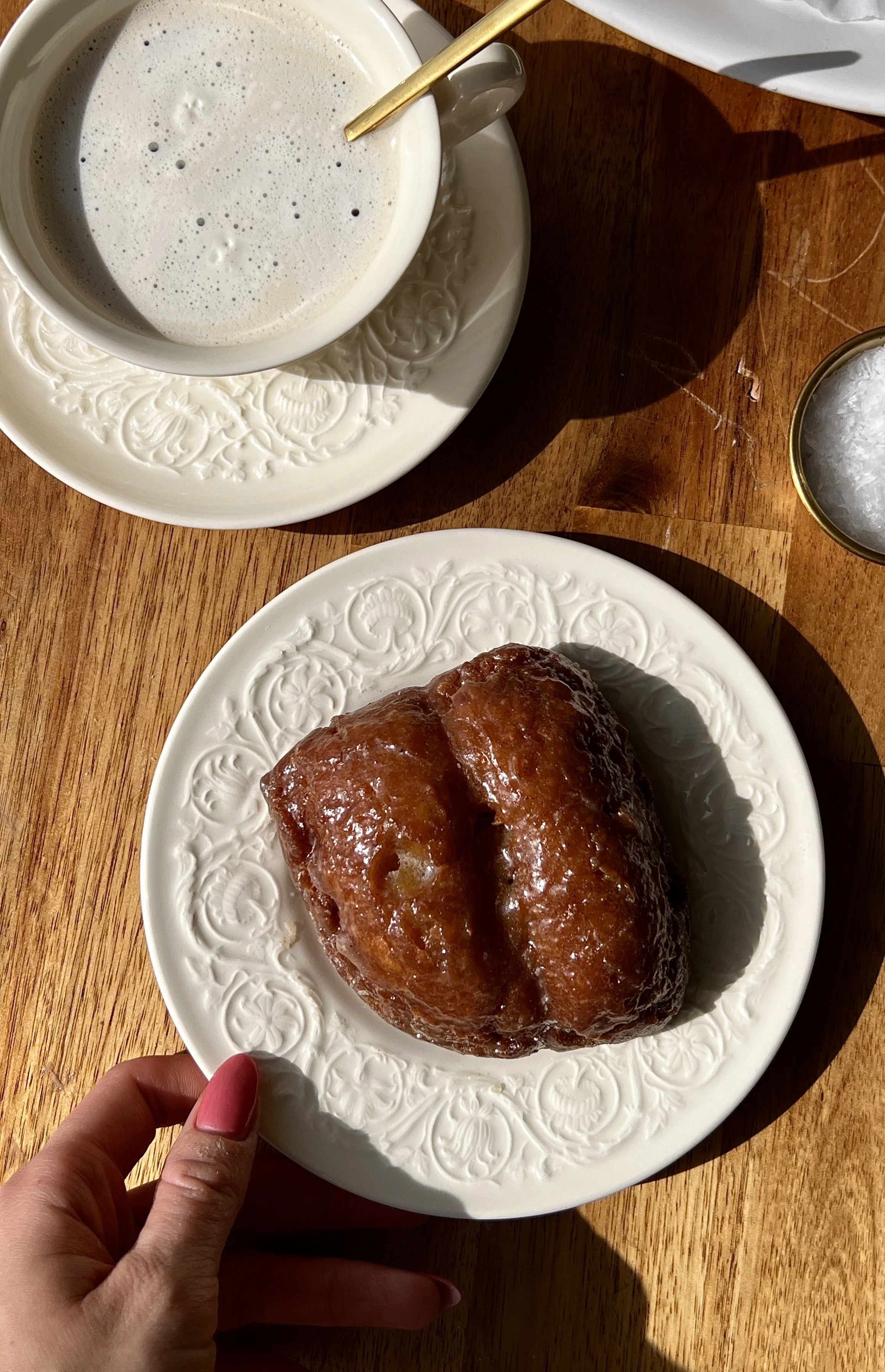 Soft and fluffy old-fashioned pumpkin donut bars with a beautifully golden and crisp exterior packed with warm cozy spiced pumpkin flavor coated in a salted maple cinnamon glaze served warm with a hot cup of coffee as the ultimate cozy fall treat.