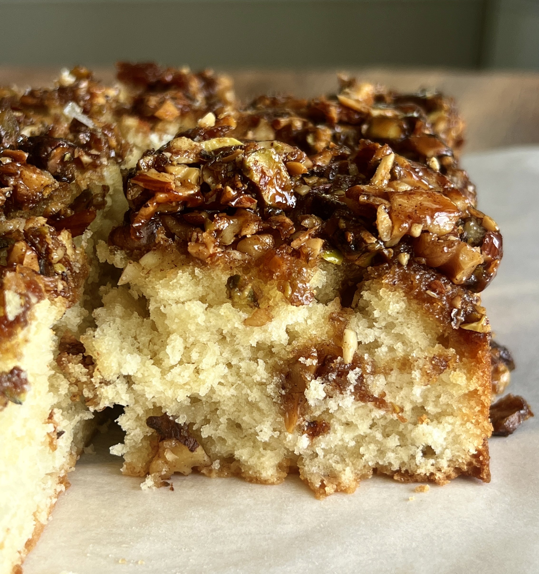 Honey-soaked baklava cake with a crunchy baklava topping, drenched in rich honey syrup.