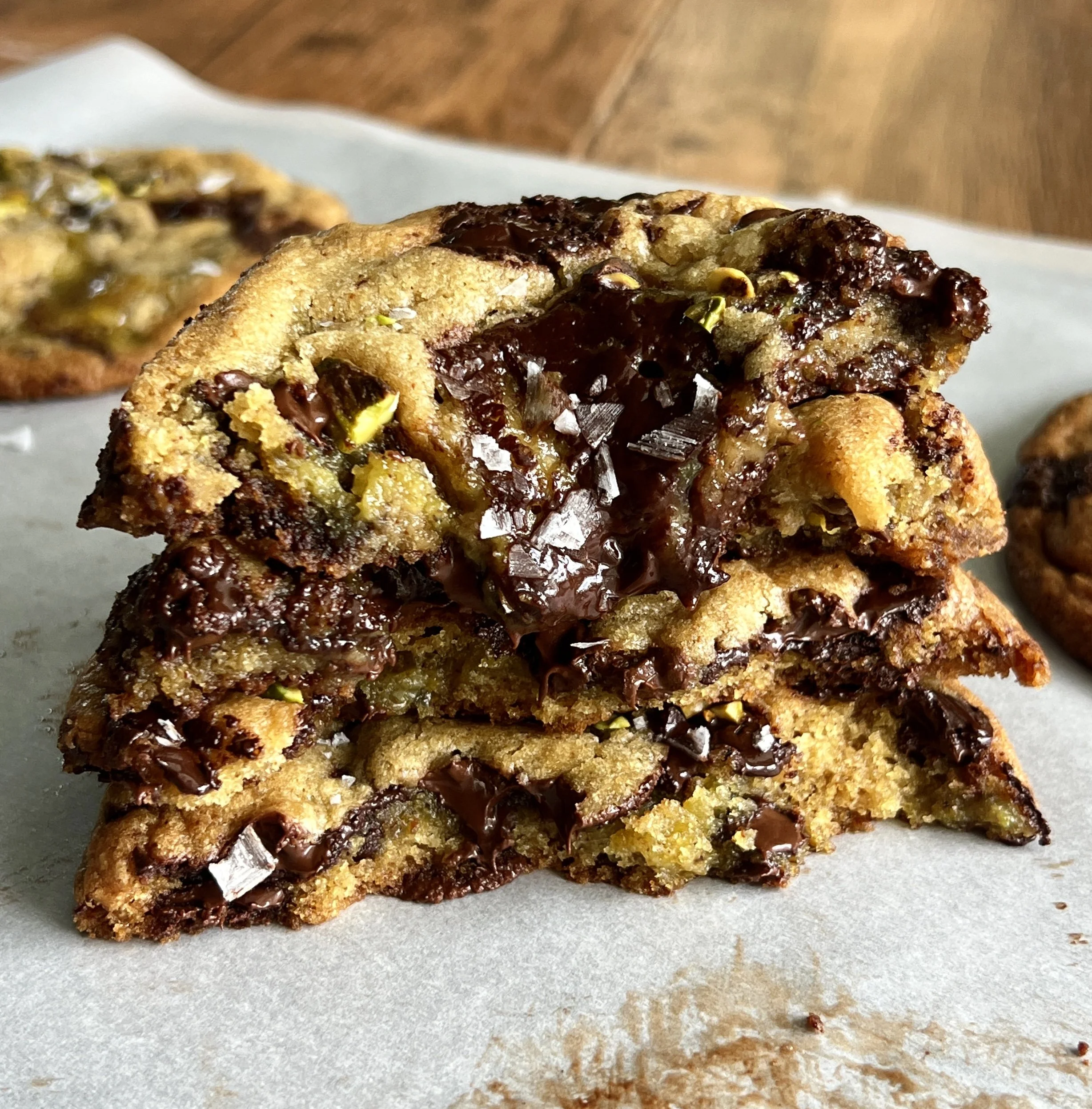 Brown butter pistachio chocolate chip cookies made with rich brown butter chocolate chip cookie dough and filled with smooth pistachio cream.