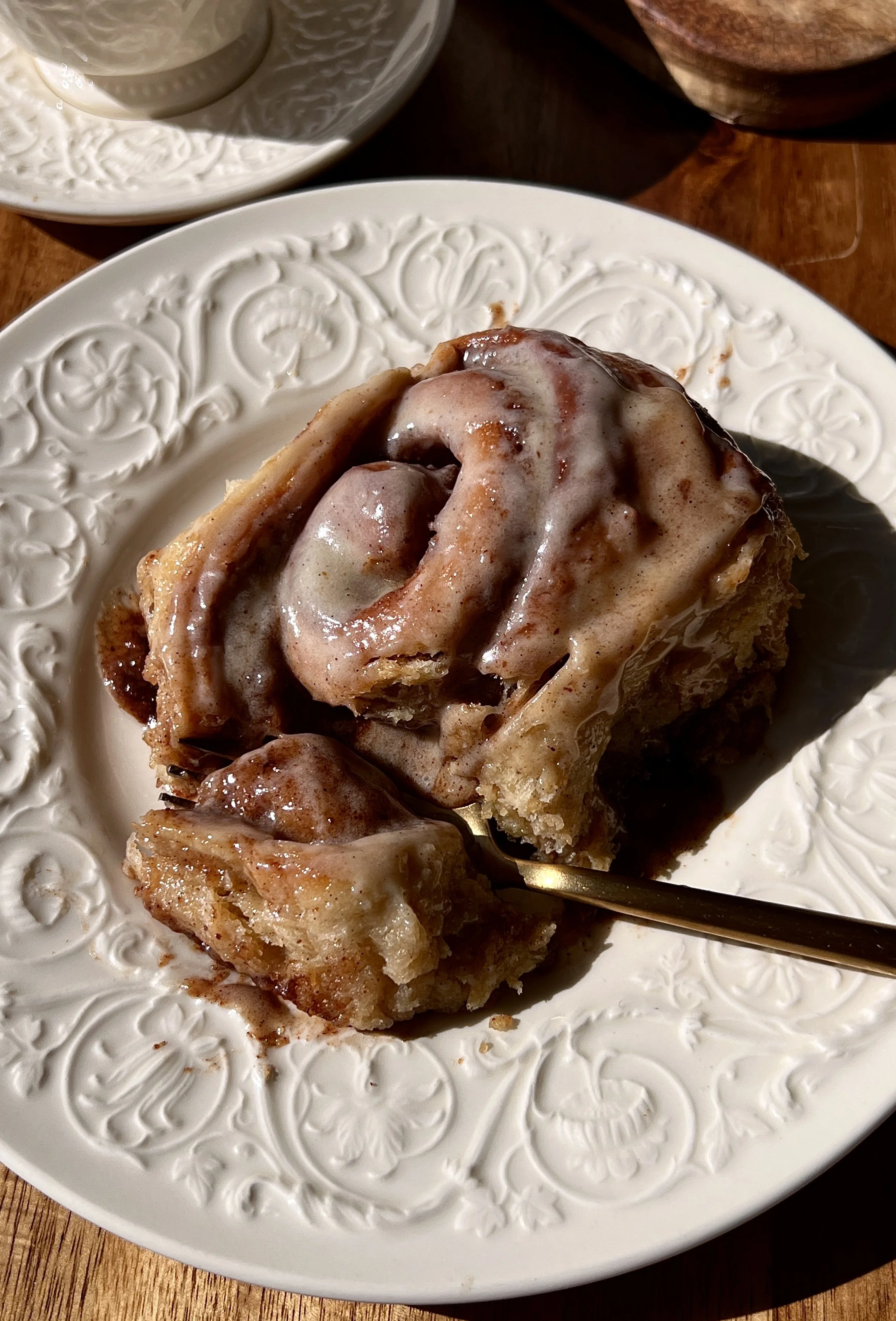 Soft, fluffy, and perfectly gooey brown butter buttermilk cinnamon rolls with beautifully golden edges and a warming brown butter cinnamon filling finished with smooth brown butter cream cheese frosting served warm with a hot cup of coffee.