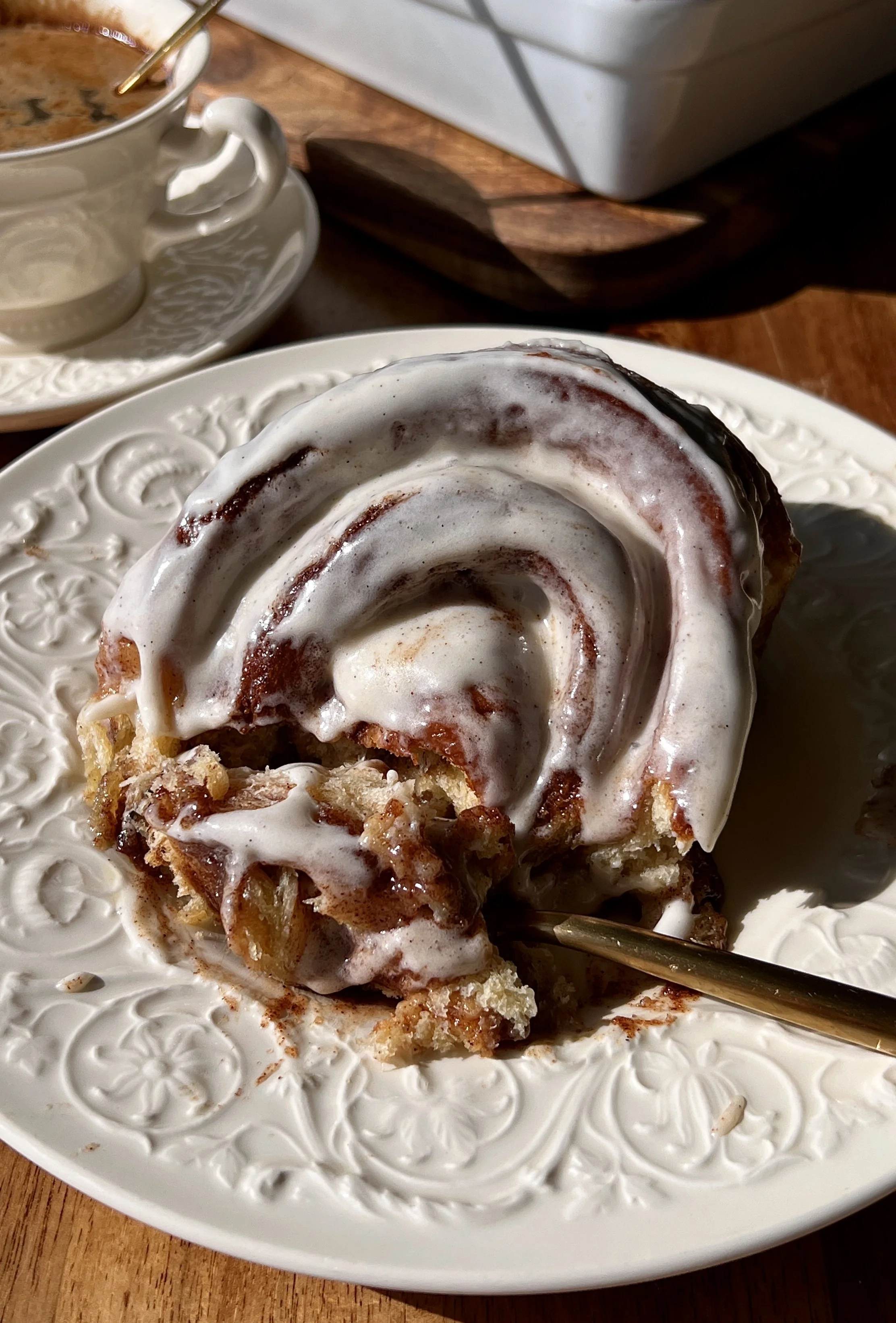 Perfect classic cinnamon rolls that are big, pillowy soft, and fluffy with a gooey cinnamon filling, topped with cream cheese frosting and served warm with coffee.