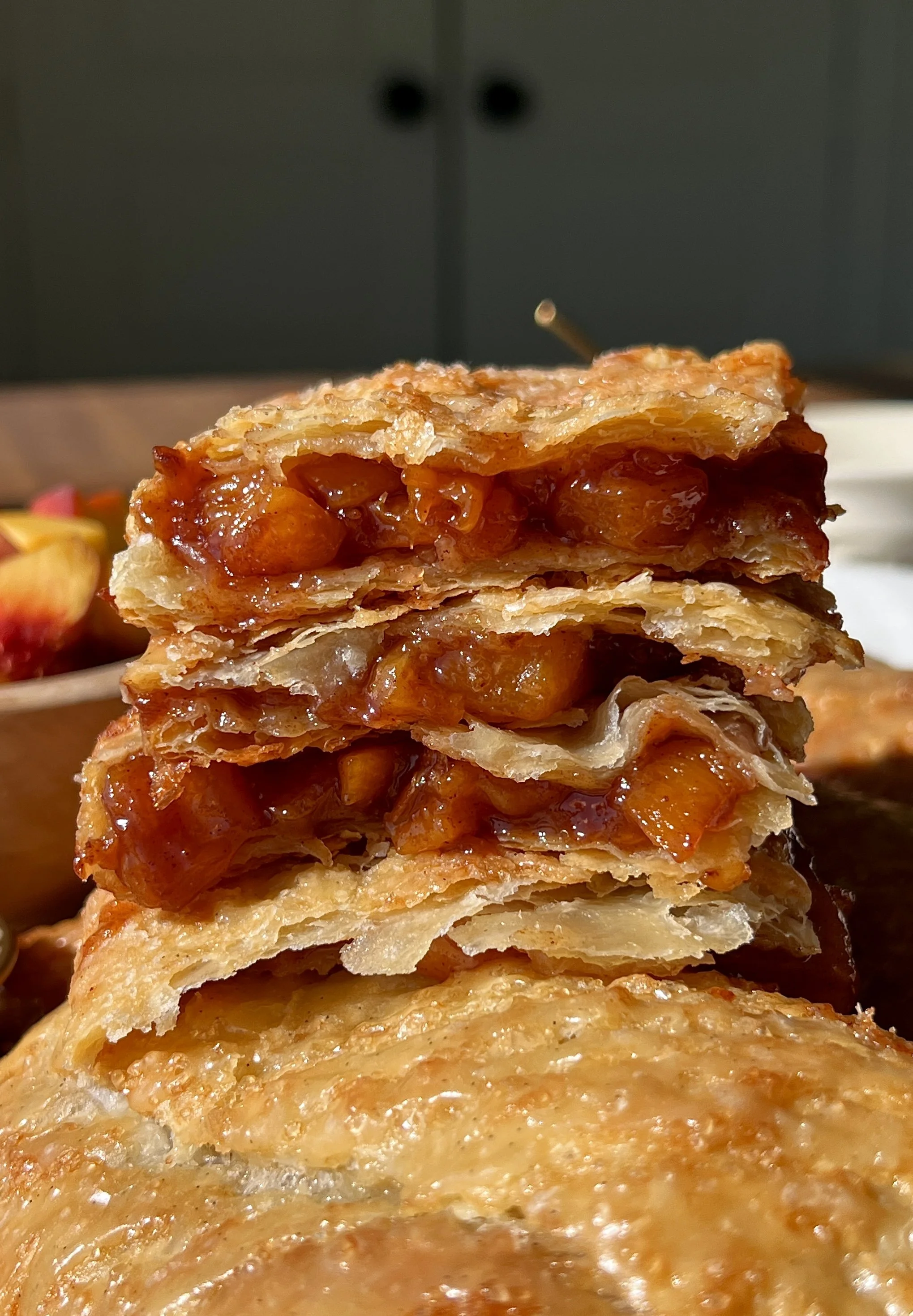 Brown sugar peach toaster strudels with homemade puff pastry finished with a maple vanilla bean glaze served warm with a hot cup of coffee.
