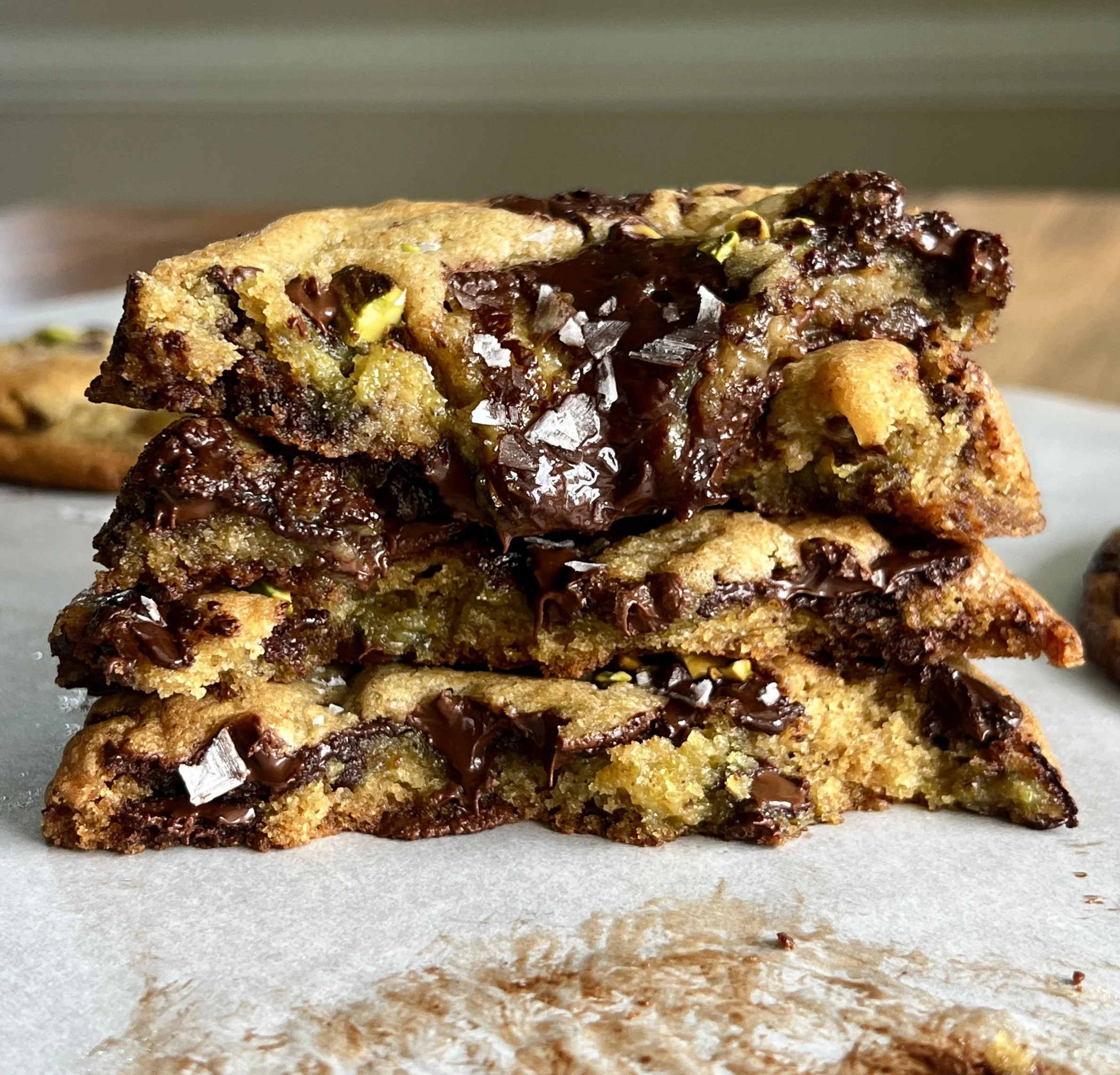 Brown butter pistachio chocolate chip cookies made with rich brown butter chocolate chip cookie dough and filled with smooth pistachio cream.