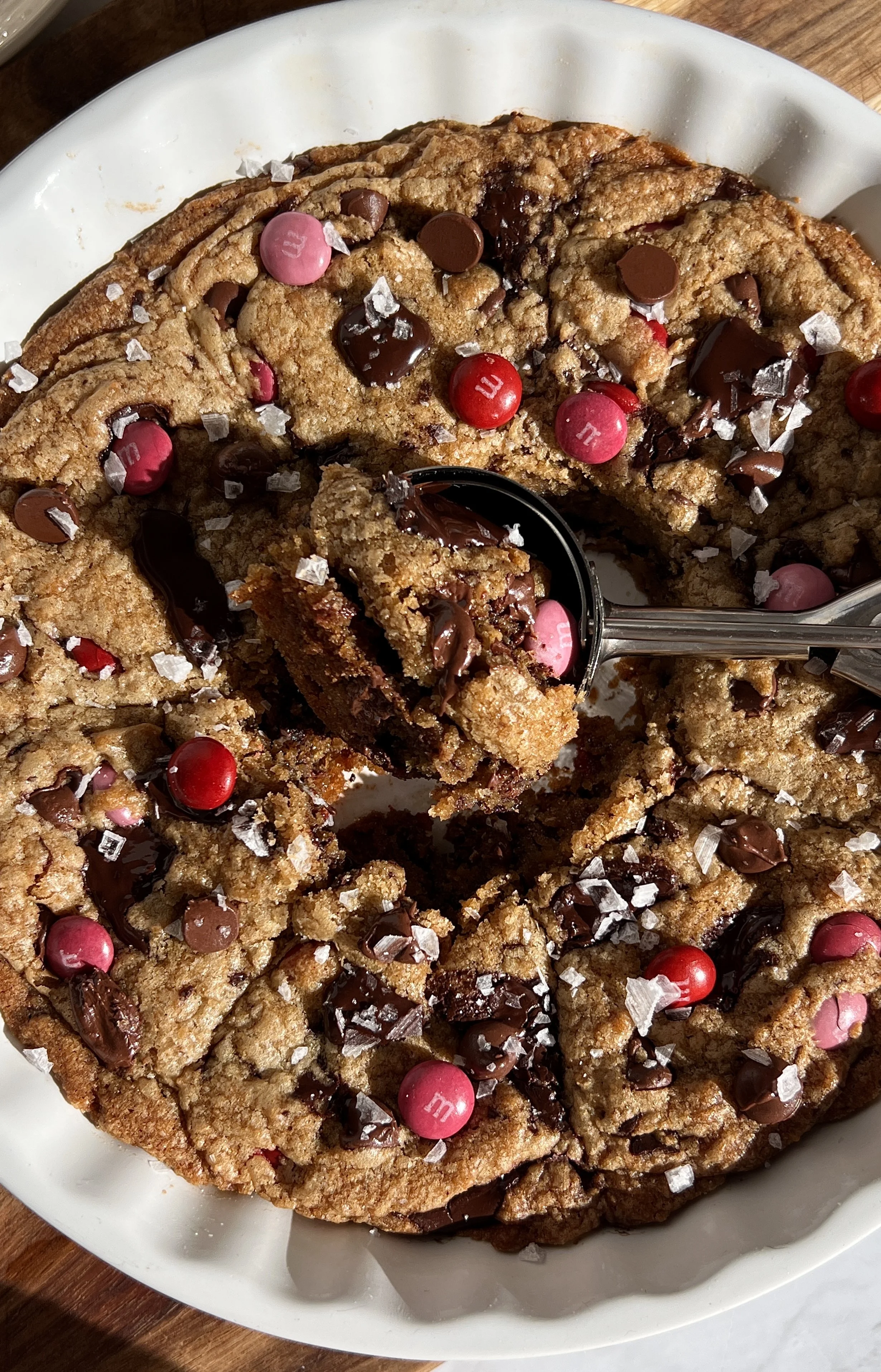 Close-up of scoopable brown butter chocolate chip cookies showing gooey centers and melted chocolate chips.