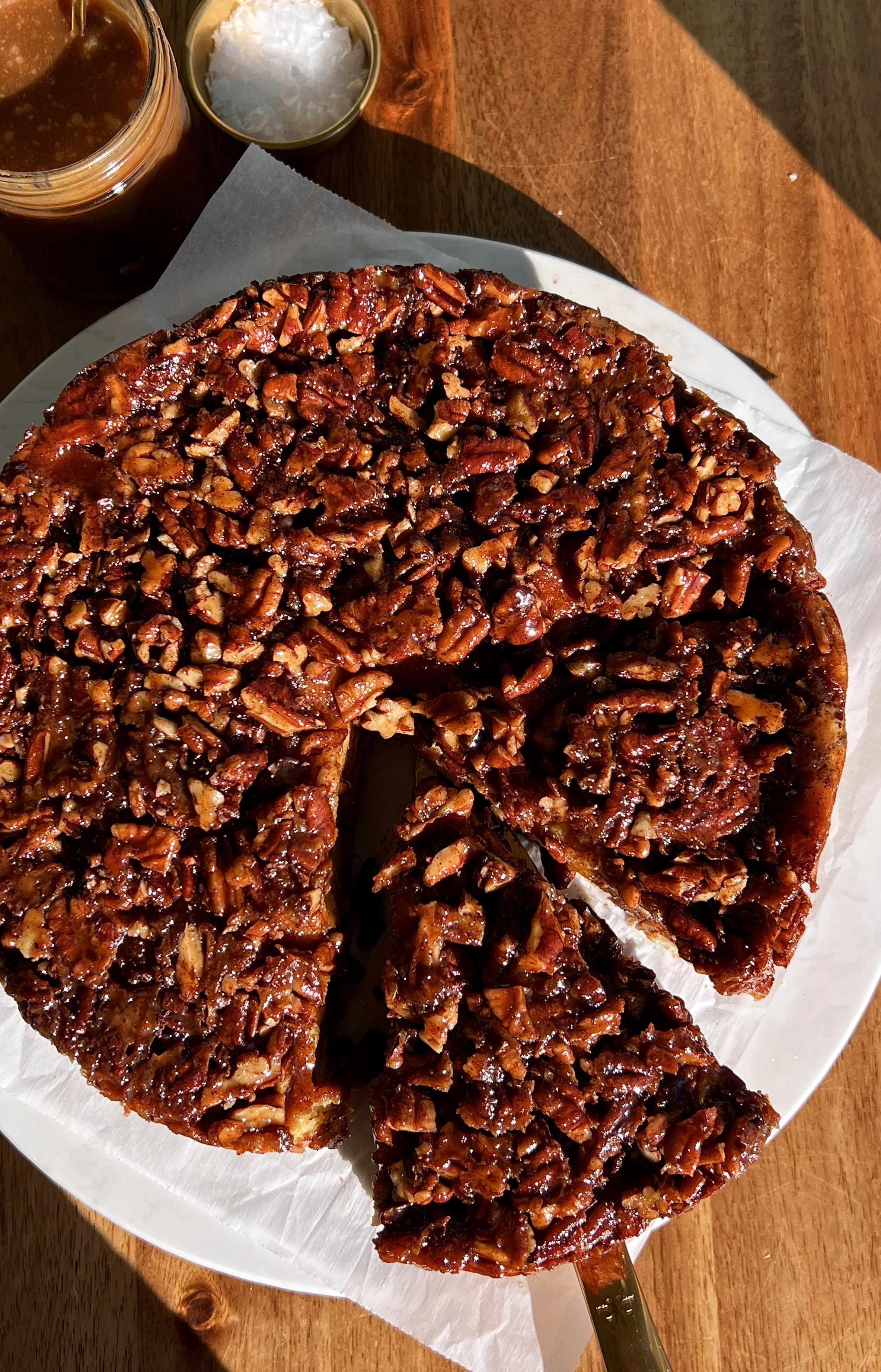 Warm pecan sticky bun bread pudding with golden top, gooey pecan topping, and soft custardy brioche.
