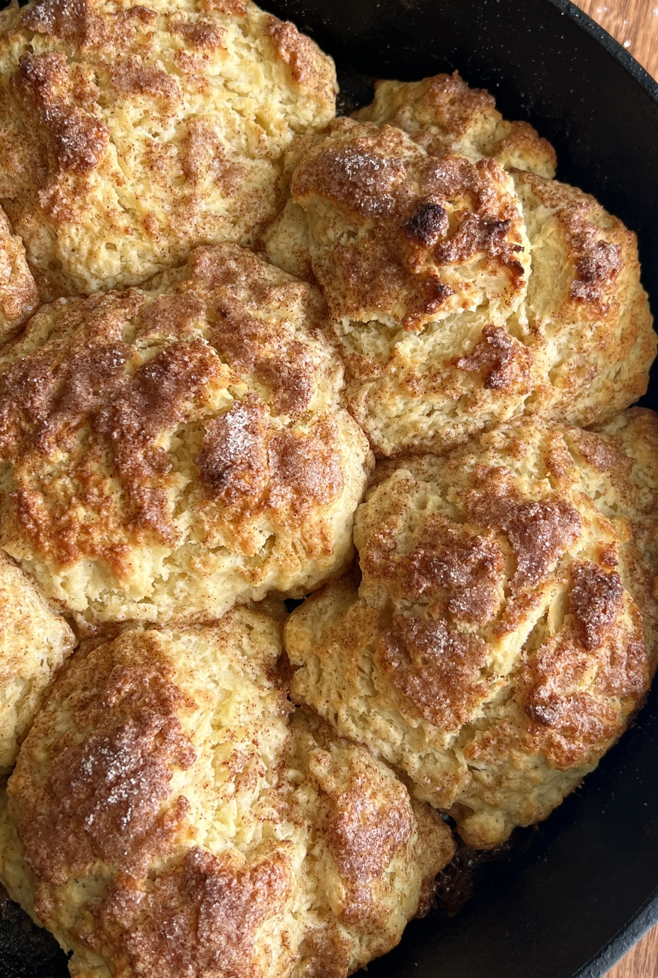 Fluffy, flaky, and buttery cinnamon crunch sourdough cathead biscuits made with sourdough discard, topped with crunchy cinnamon sugar, served with butter and flaky sea salt.