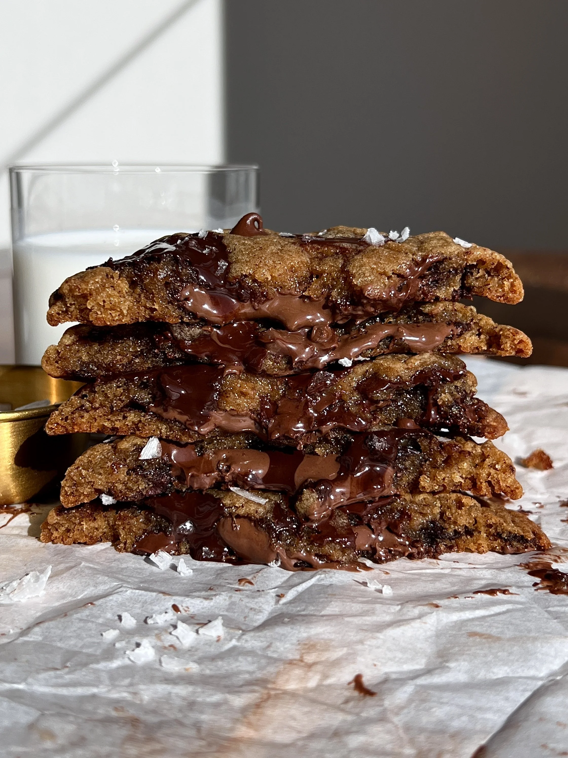Nutella stuffed banana bread chocolate chip cookies with brown butter, crinkly edges, and flaky sea salt.