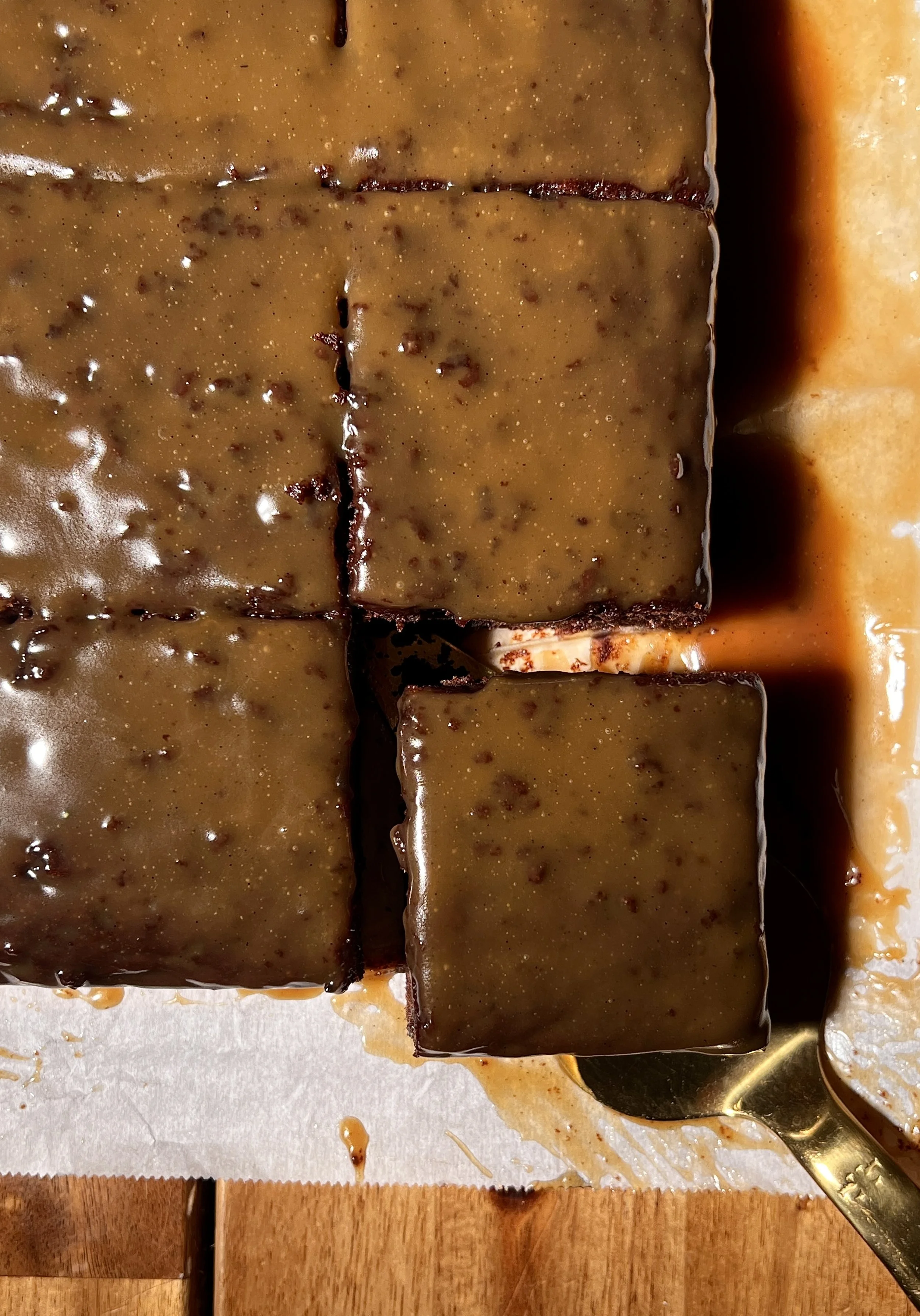 Chocolate espresso sticky toffee pudding served warm with vanilla ice cream, toffee sauce, and flaky sea salt.