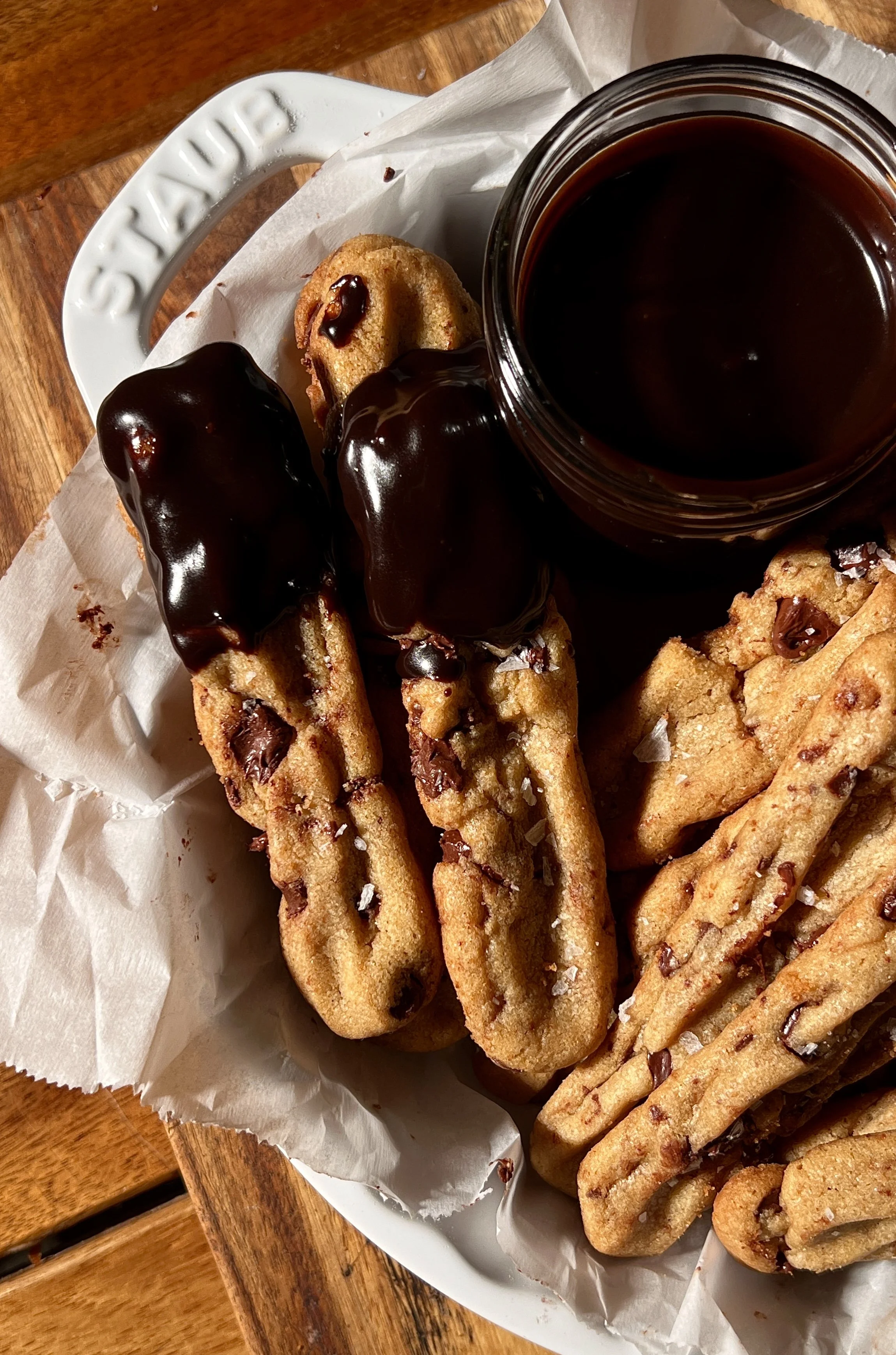 Brown butter chocolate chip cookie fries with crisp edges and melty chocolate chips, served warm with hot fudge sauce and flaky sea salt.