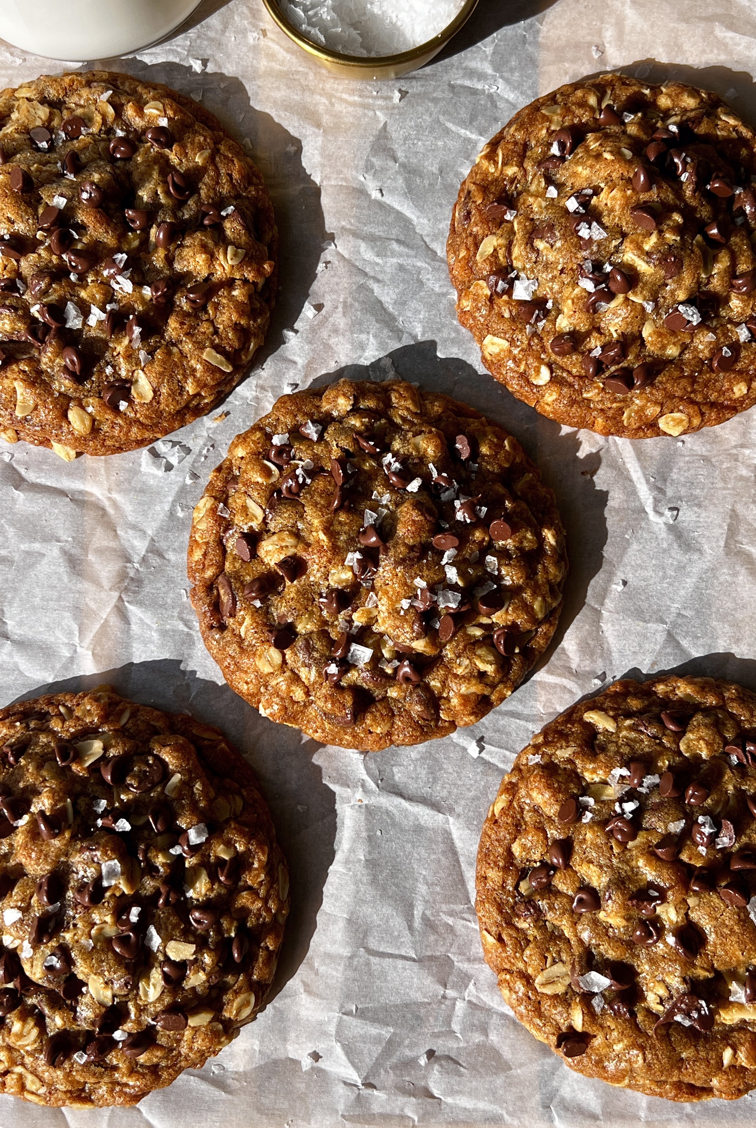 Nutella stuffed pumpkin oatmeal cookies with brown butter soft and gooey in the middle with perfectly crisp golden edges melty chocolate chips and a sprinkle of flaky sea salt.