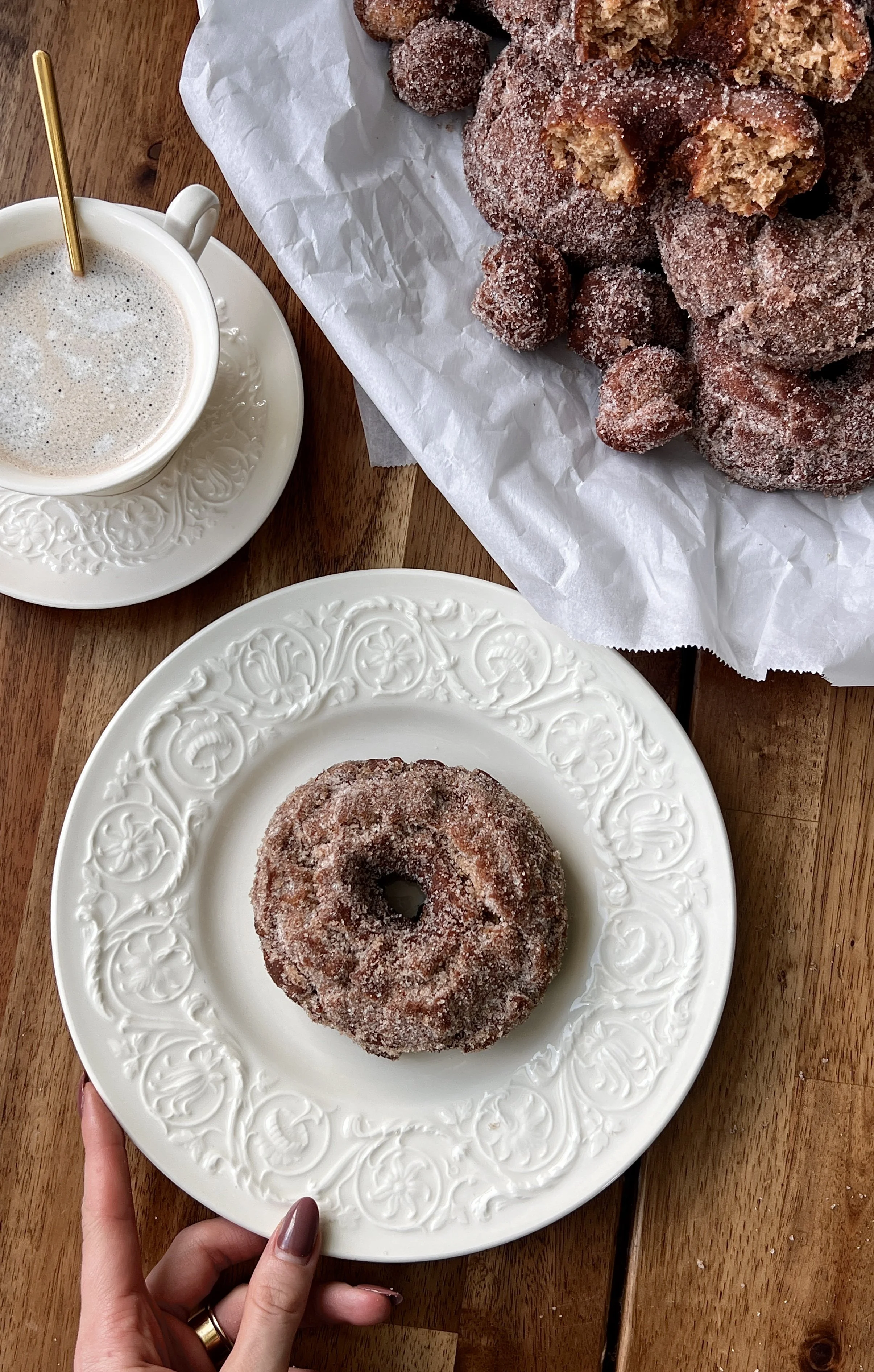 Close-up of Homemade Old-Fashioned Apple Cider Donuts coated in cinnamon sugar and served warm with coffee