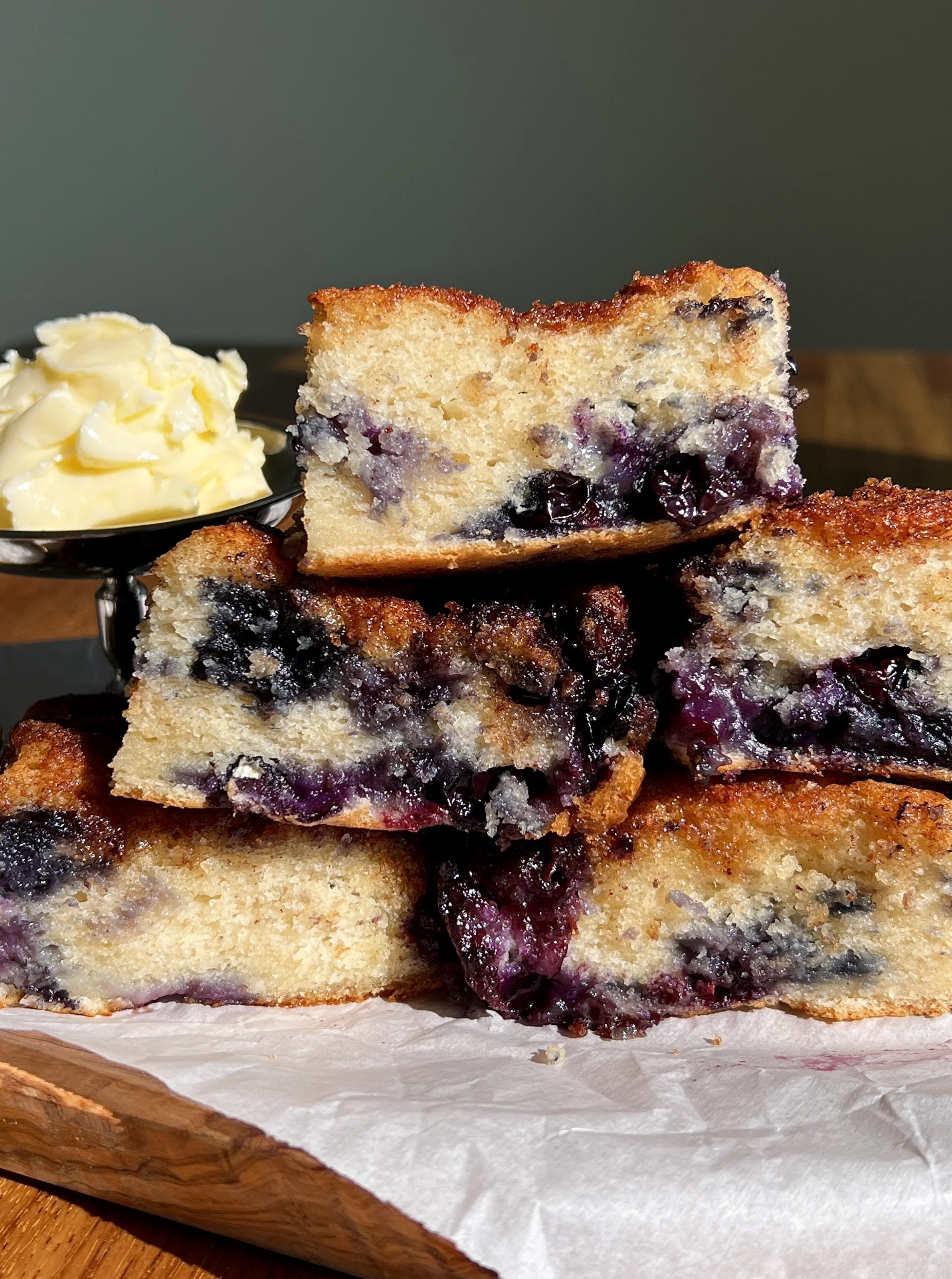 Soft and fluffy blueberry butter swim biscuits with cinnamon sugar crunch topping.