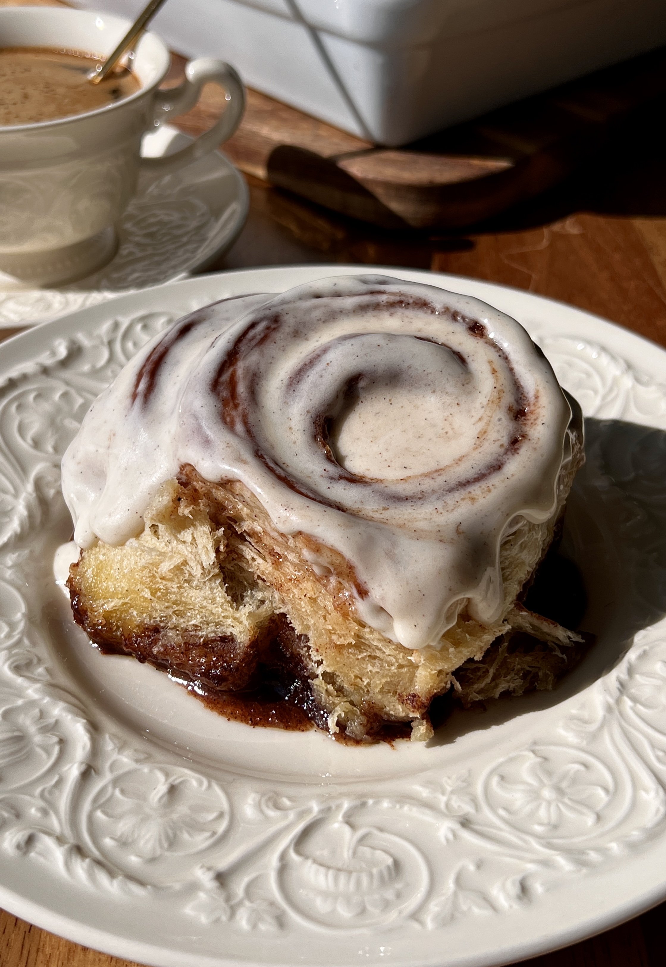 Perfect classic cinnamon rolls that are big, pillowy soft, and fluffy with a gooey cinnamon filling, topped with cream cheese frosting and served warm with coffee.
