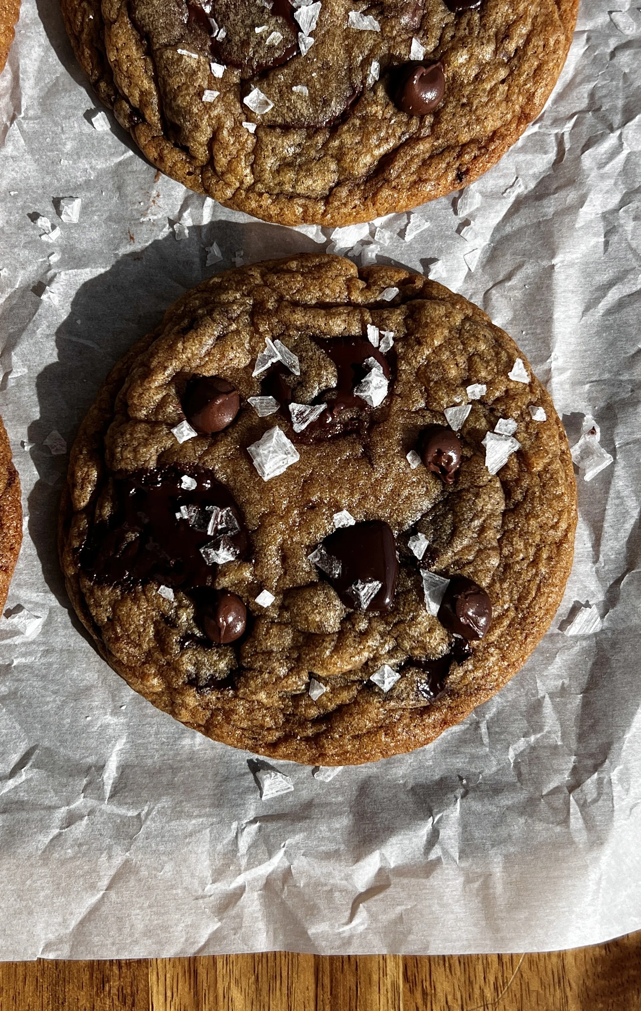 Nutella stuffed banana bread chocolate chip cookies with brown butter, crinkly edges, and flaky sea salt.